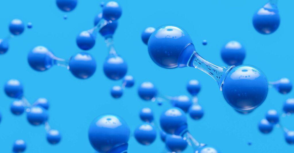 Close-up of hydrogen molecules against a blue background, highlighting the potential of hydrogen in clean energy solutions.