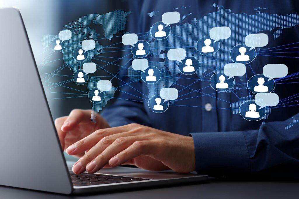 Laptop user with global chat icons – representing online engagement and communication in an onlyfans chatter job application